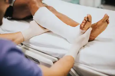 Man helping Injury patient